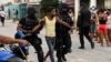 Un joven detenido en La Güinera, en el municipio de Arroyo Naranjo, La Habana, el 12 de julio de 2021.